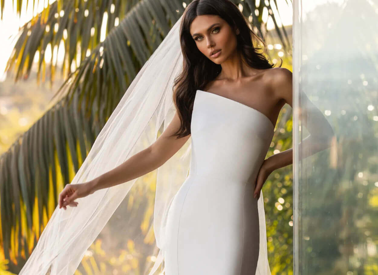 Model wearing a white a Pronovias Gown
